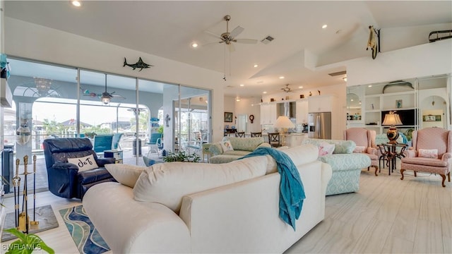 living room featuring ceiling fan and high vaulted ceiling