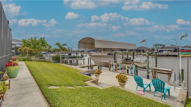 view of dock featuring a lawn and a water view