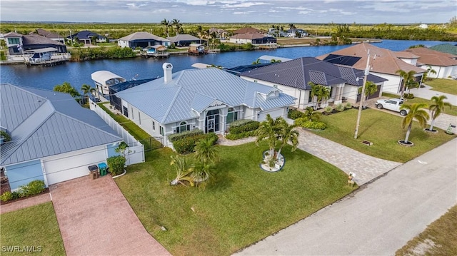 birds eye view of property with a water view