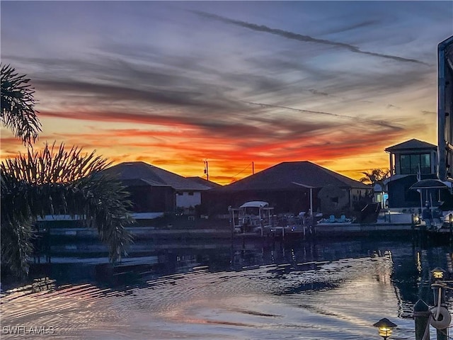 pool at dusk with a water view