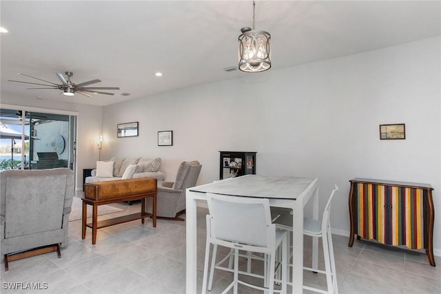 dining room with ceiling fan with notable chandelier, baseboards, recessed lighting, and light tile patterned floors