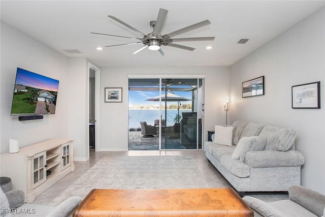 living room featuring recessed lighting, visible vents, ceiling fan, and baseboards