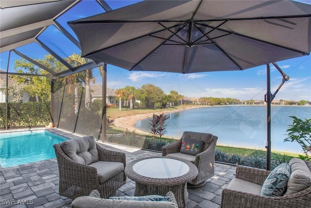 outdoor pool with a water view, a patio area, glass enclosure, and outdoor lounge area