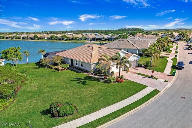 bird's eye view featuring a water view and a residential view