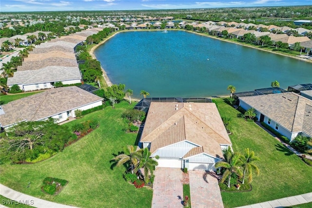 birds eye view of property featuring a residential view and a water view