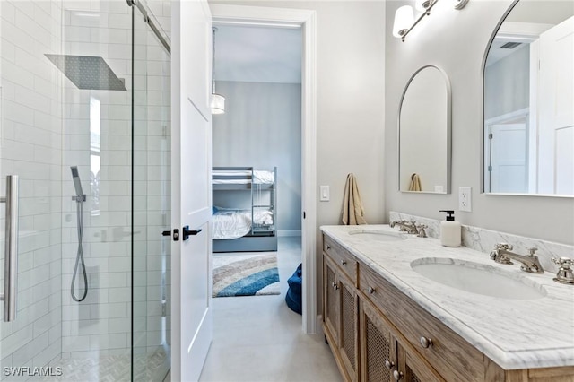 bathroom with vanity and tiled shower