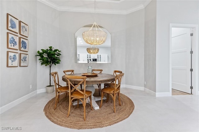 dining area with an inviting chandelier and ornamental molding