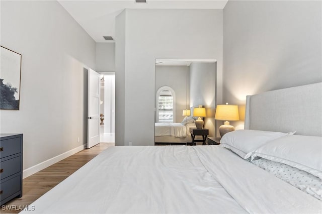 bedroom with light hardwood / wood-style flooring