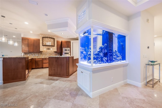 kitchen with decorative light fixtures, tasteful backsplash, a center island, appliances with stainless steel finishes, and light stone counters