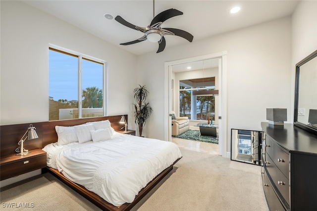 carpeted bedroom featuring ceiling fan