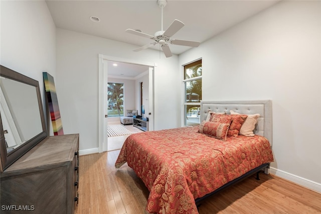 bedroom with ceiling fan and light wood-type flooring