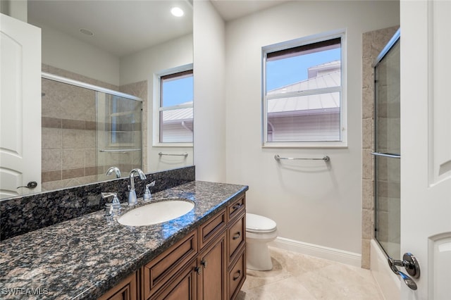 bathroom featuring tile patterned floors, toilet, and vanity