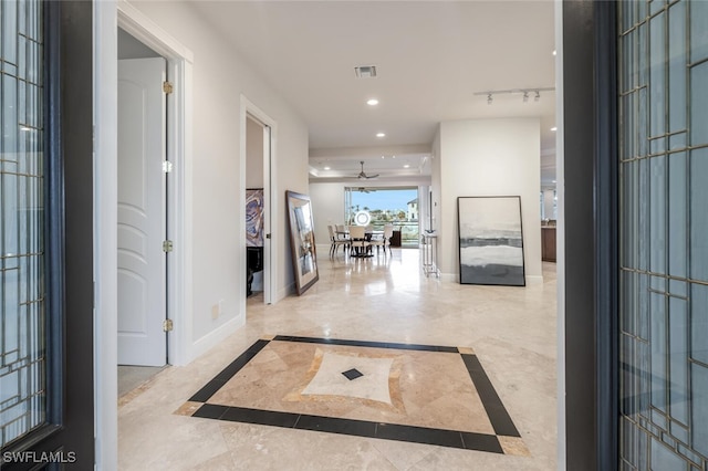 foyer with ceiling fan