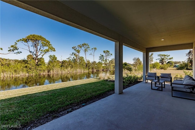 view of patio with a water view