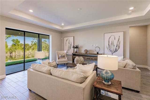 living room with a tray ceiling