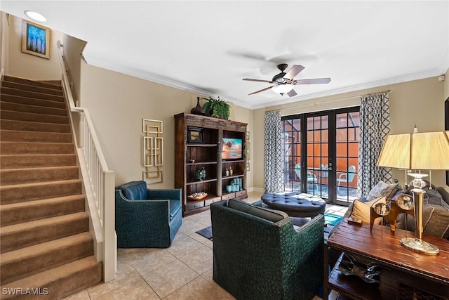 living room featuring light tile patterned floors, ceiling fan, ornamental molding, and french doors