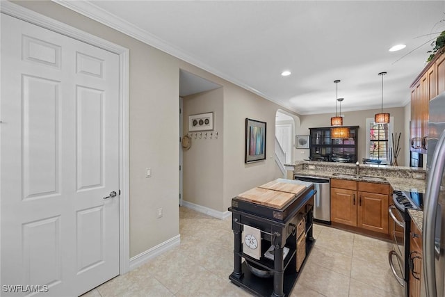 kitchen with decorative light fixtures, sink, light stone countertops, appliances with stainless steel finishes, and ornamental molding