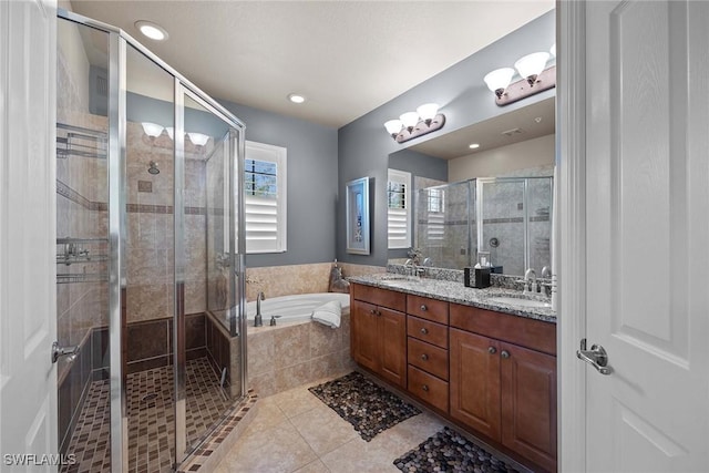 bathroom with vanity, tile patterned floors, and shower with separate bathtub