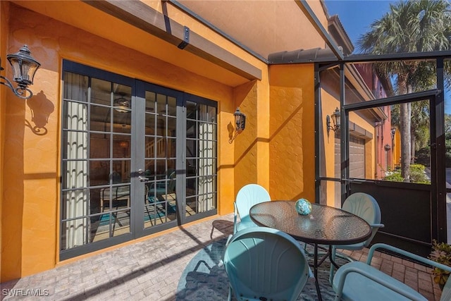 balcony featuring a patio area and french doors