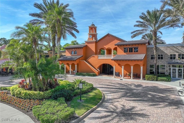 mediterranean / spanish-style home with a balcony