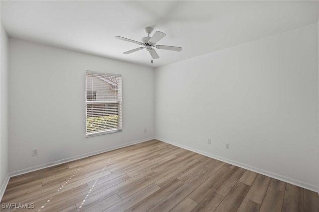 empty room featuring light hardwood / wood-style floors and ceiling fan