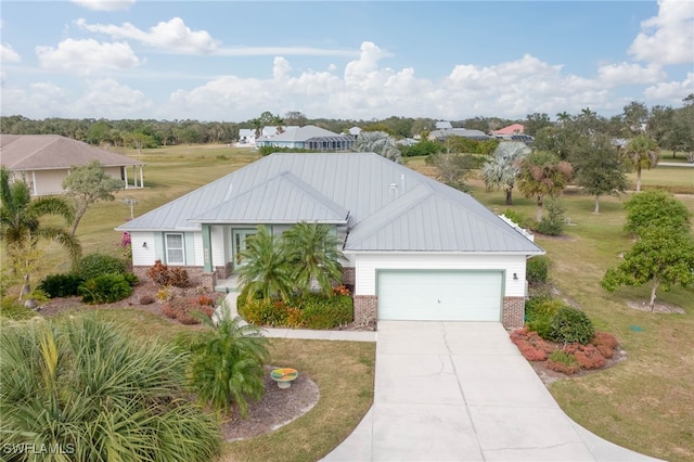 view of front of house with a garage and a front lawn