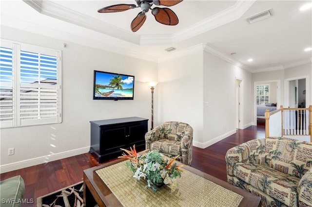 living room featuring ceiling fan, crown molding, and dark wood-type flooring