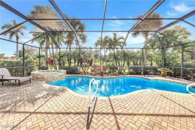 view of swimming pool with a lanai, an in ground hot tub, and a patio