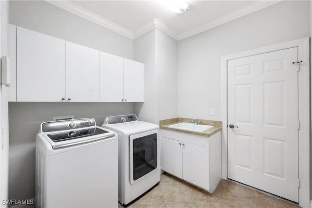 laundry area with cabinets, sink, washing machine and dryer, ornamental molding, and light tile patterned flooring