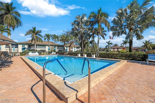 view of swimming pool with a patio