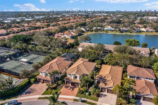 birds eye view of property with a water view