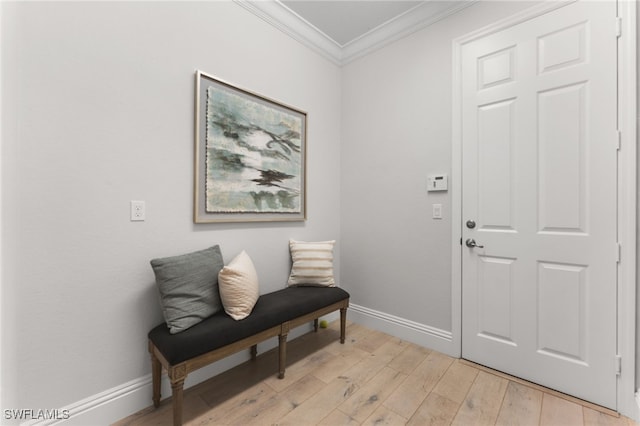 interior space featuring light hardwood / wood-style flooring and crown molding