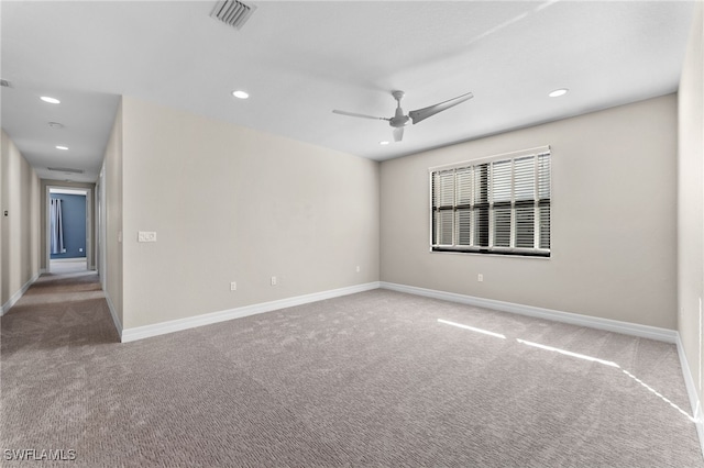 empty room with carpet floors and ceiling fan