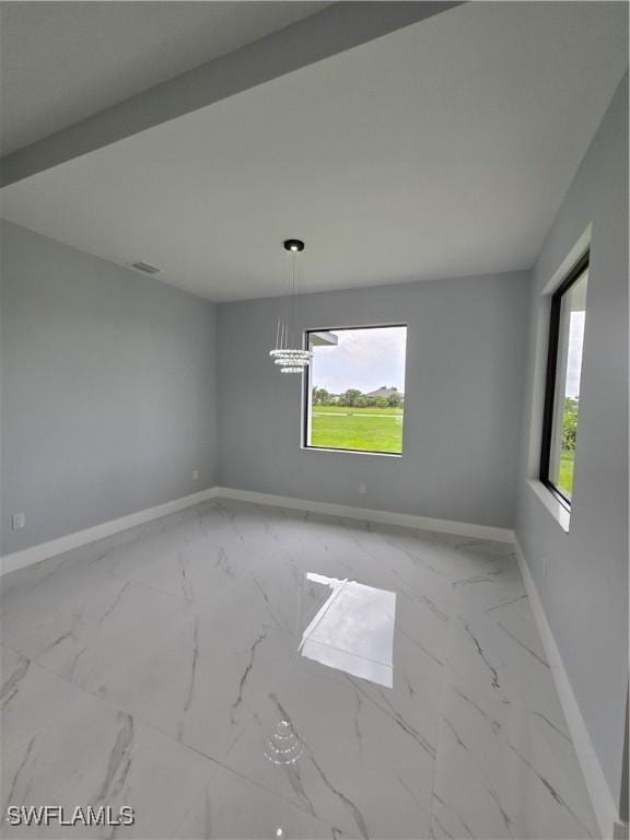 unfurnished dining area featuring plenty of natural light