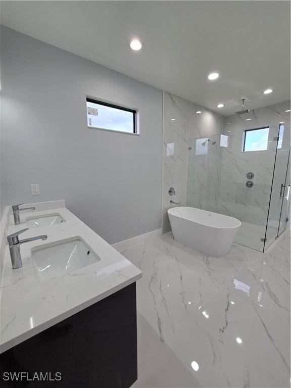 bathroom featuring vanity and separate shower and tub