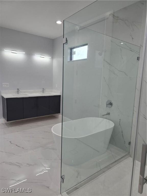 bathroom with a bathing tub and vanity