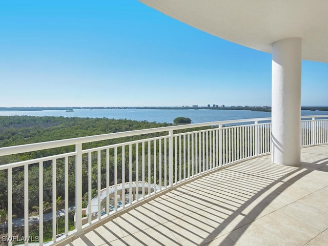 balcony featuring a water view