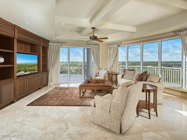 sunroom with ceiling fan, coffered ceiling, plenty of natural light, and beam ceiling