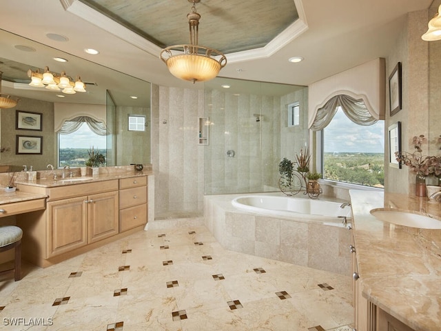 bathroom with vanity, shower with separate bathtub, a raised ceiling, and crown molding