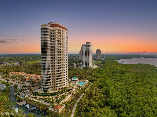 aerial view at dusk with a water view