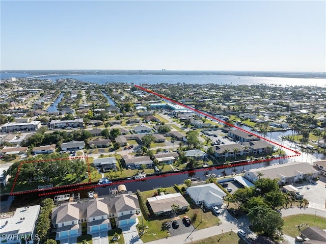 birds eye view of property featuring a water view