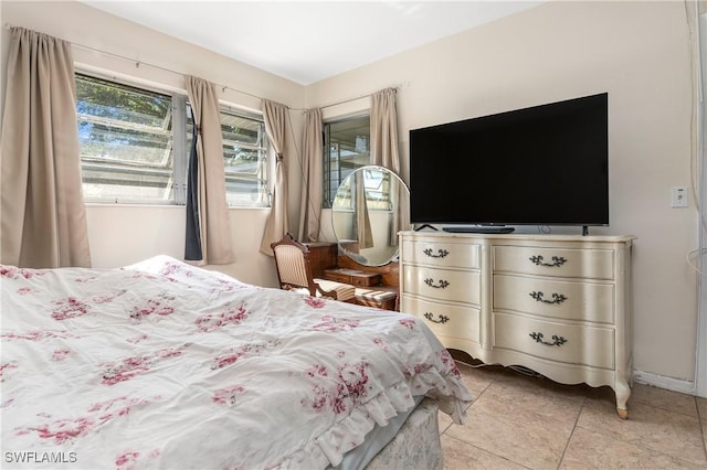 bedroom featuring light tile patterned flooring