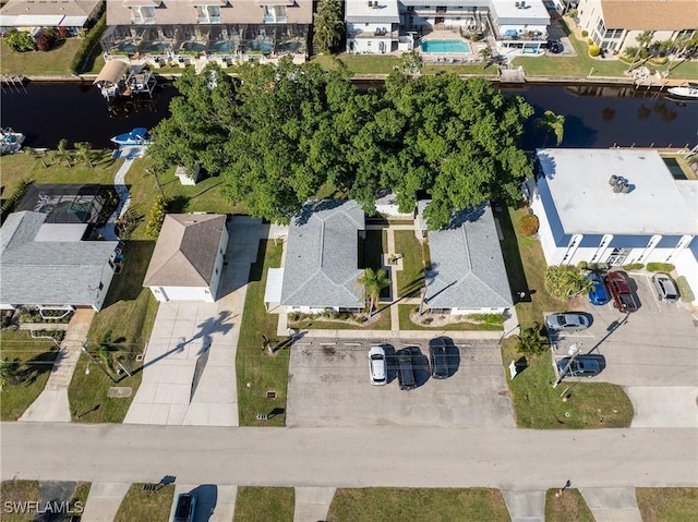 birds eye view of property featuring a water view