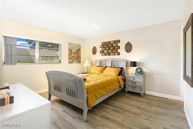 bedroom featuring hardwood / wood-style floors