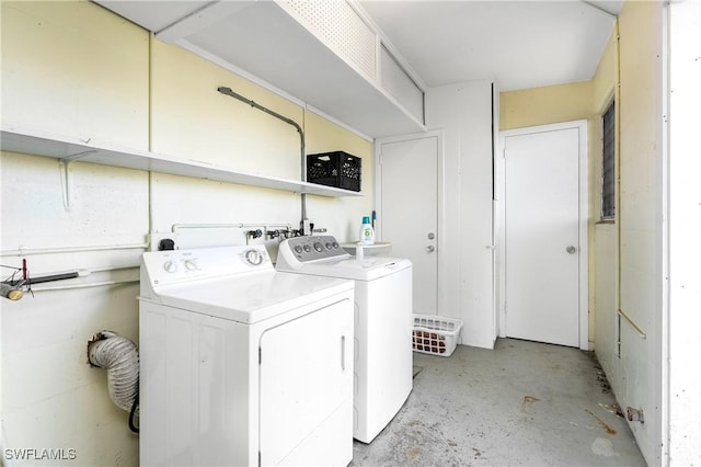 washroom with washer and dryer