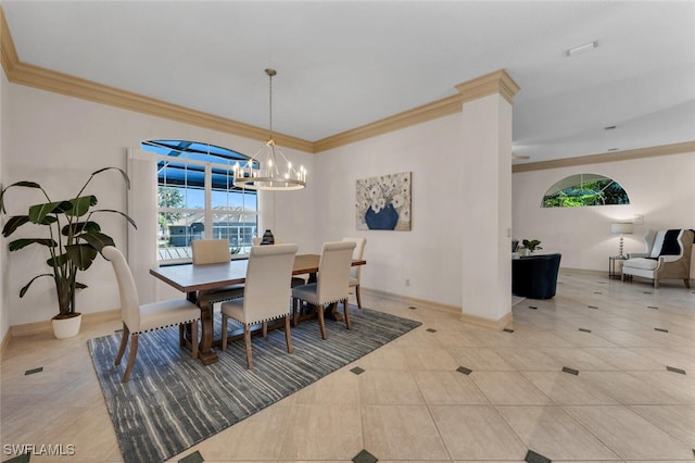 dining space with light tile patterned floors, a notable chandelier, and ornamental molding