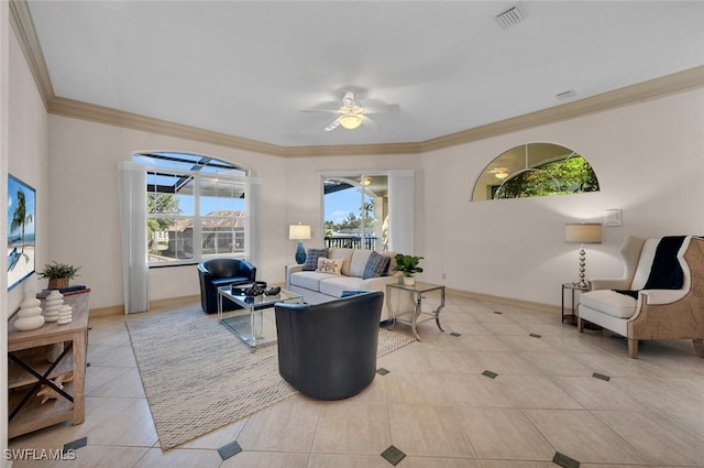 living room with light tile patterned flooring, ceiling fan, and crown molding