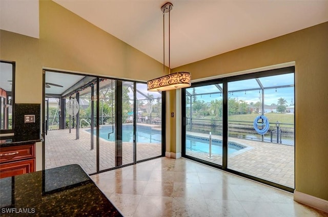 doorway to outside with vaulted ceiling