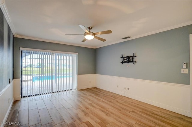 unfurnished room with crown molding, ceiling fan, and light hardwood / wood-style flooring