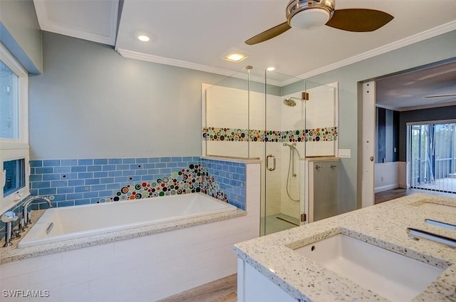 bathroom with vanity, crown molding, plus walk in shower, and ceiling fan